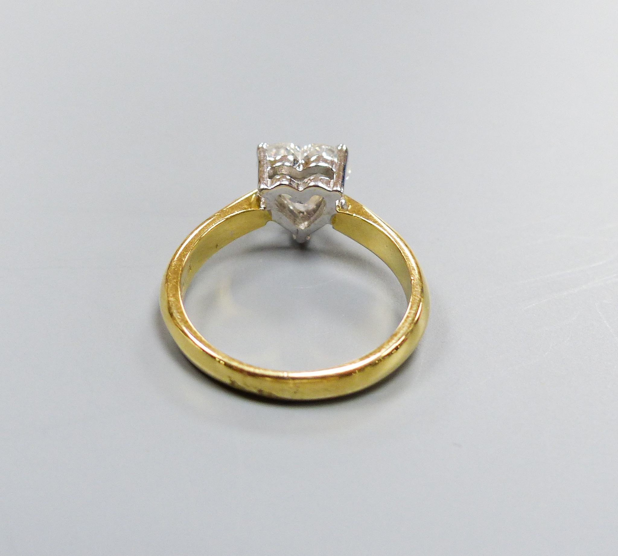 A modern 18ct gold and solitaire heart shaped diamond ring, size K, gross weight 3.6 grams